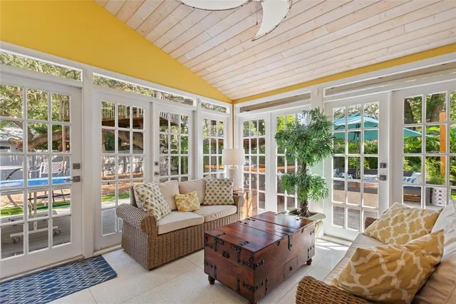 a living room with furniture and windows