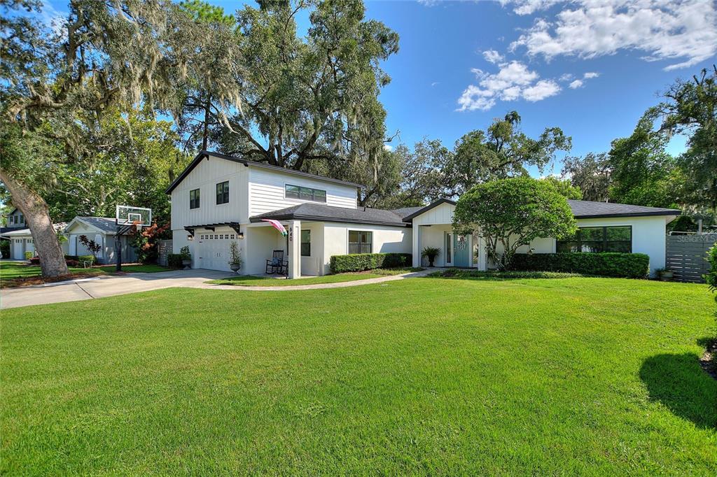 640 Arjay Way Winter Park, FL 32789 - Photo 2 of 46 a front view of a house with a garden