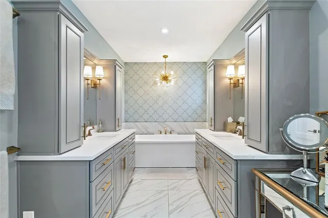 a bathroom with a double vanity sink a mirror and a bathtub