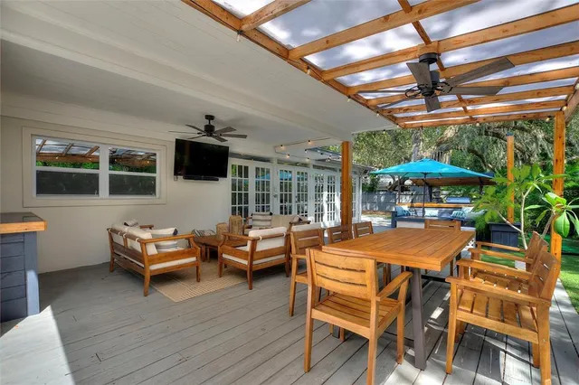 a outdoor space with patio lots of furniture and wooden floor