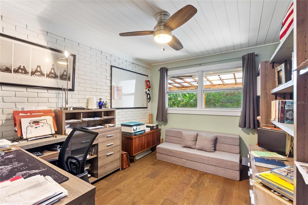 640 Arjay Way Winter Park, FL 32789 - Photo 36 of 46 a living room with furniture and a flat screen tv