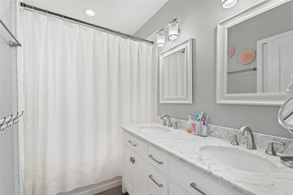 640 Arjay Way Winter Park, FL 32789 - Photo 39 of 46 a bathroom with a granite countertop sink and a mirror