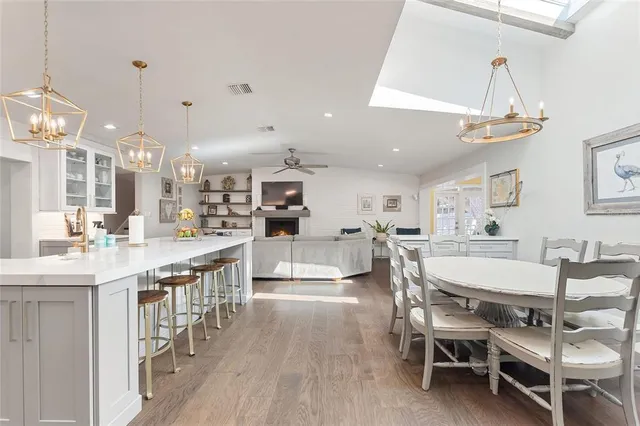a large kitchen with a table and chairs