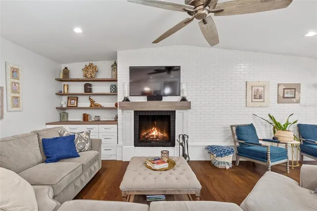 a living room with furniture and a fireplace