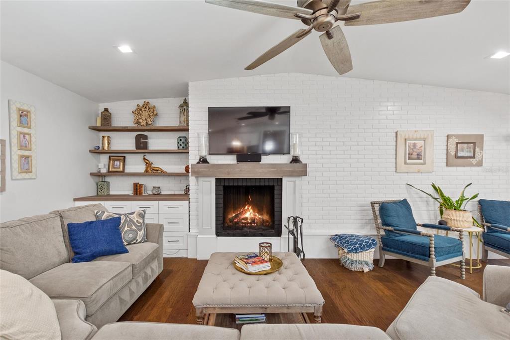640 Arjay Way Winter Park, FL 32789 - Photo 10 of 46 a living room with furniture and a fireplace