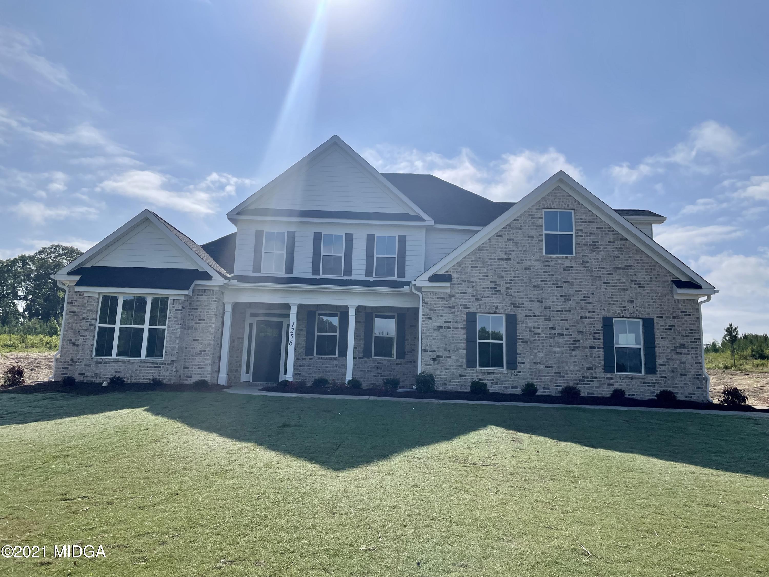 1256 Bunn Road Forsyth, GA 31029 - Photo 1 of 12 a front view of a house with a yard