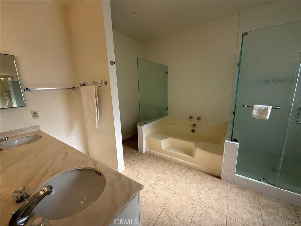 415 West Duarte Road Arcadia, CA 91007 - Photo 14 of 14 a bathroom with a tub and a shower