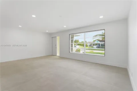a kitchen with granite countertop a sink and a stove