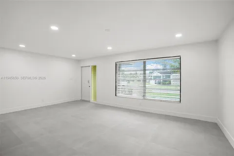 a kitchen with a sink a washer and dryer