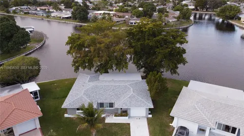 a view of green field with house in the background