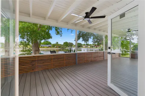 a view of a back yard with a lake view