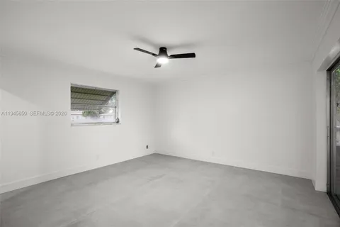 an aerial view of a house with a yard and garden