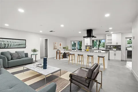 a view of kitchen with refrigerator and window