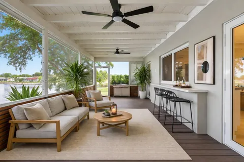a kitchen with stainless steel appliances kitchen island granite countertop a sink and cabinets