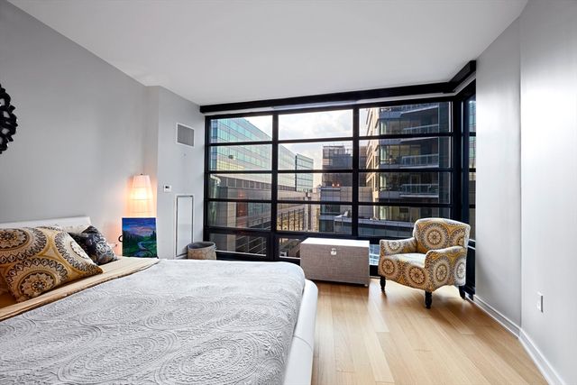 a bedroom with furniture and a window