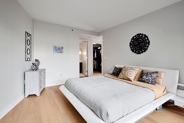 a bedroom with a bed and a walk in closet