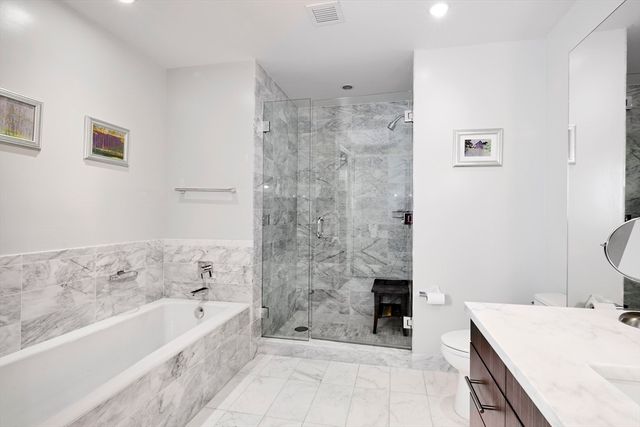 a bathroom with a bathtub and a sink