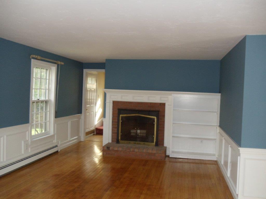 9 Hyde Park Centerville, MA 02632 - Photo 13 of 27 a living room with a fireplace