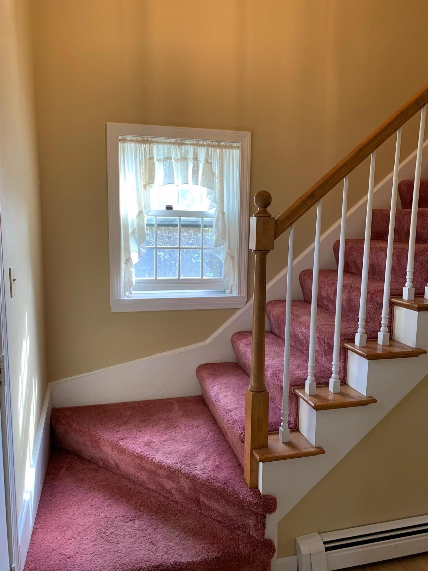 9 Hyde Park Centerville, MA 02632 - Photo 14 of 27 a view of staircase with wooden floor and a window