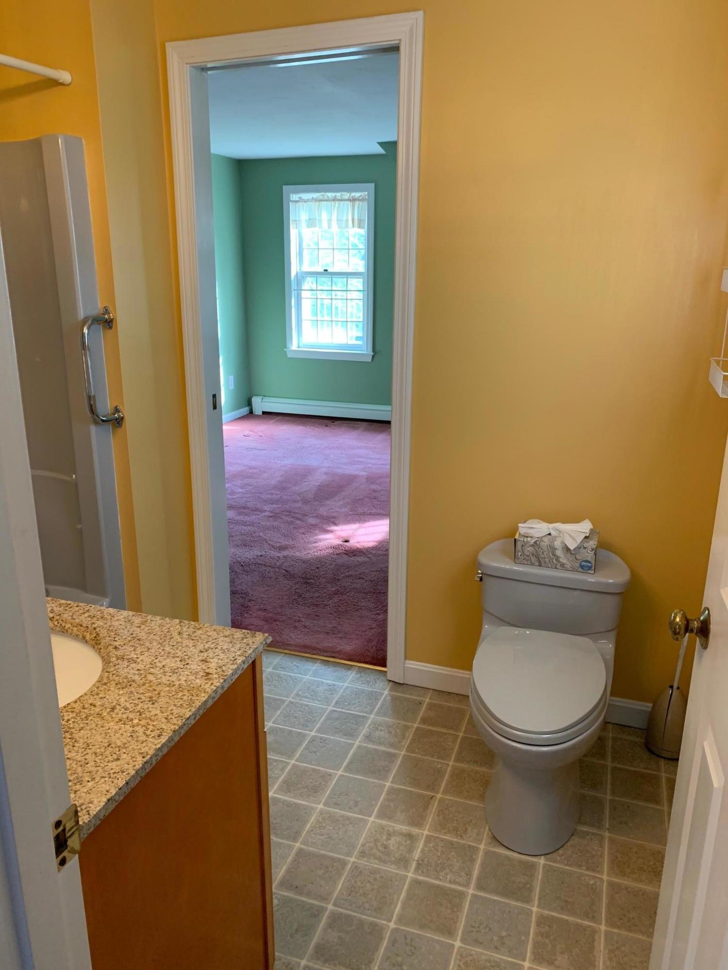 9 Hyde Park Centerville, MA 02632 - Photo 20 of 27 a bathroom with a granite countertop toilet and a sink