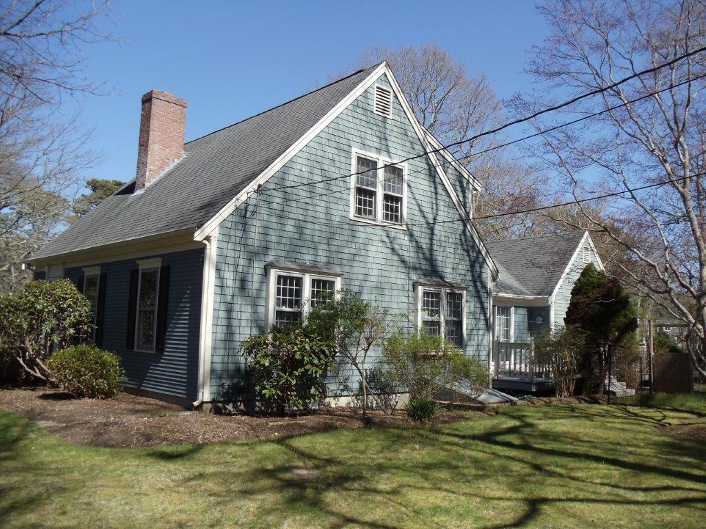9 Hyde Park Centerville, MA 02632 - Photo 22 of 27 a front view of a house with a yard