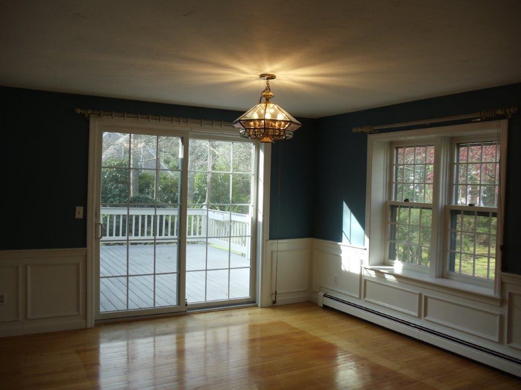 9 Hyde Park Centerville, MA 02632 - Photo 10 of 27 a very nice looking room with wooden floor and a large window