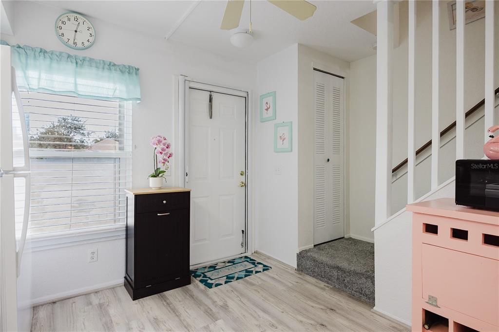 26282 Rampart Boulevard, Unit 204 Punta Gorda, FL 33983 - Photo 7 of 34 a view of a hallway with workspace and wooden floor