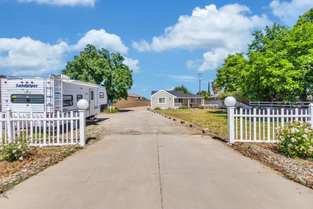 8685 East Stockton Boulevard Elk Grove, CA 95624 - Photo 17 of 29 a view of a pathway with a wrought fence