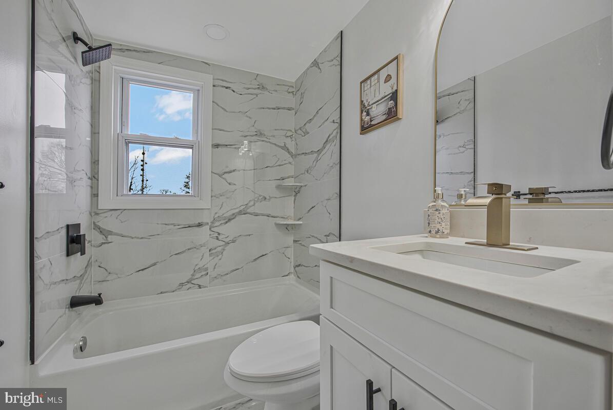 6508 Foster Street District Heights, MD 20747 - Photo 25 of 39 a bathroom with a sink a toilet and shower