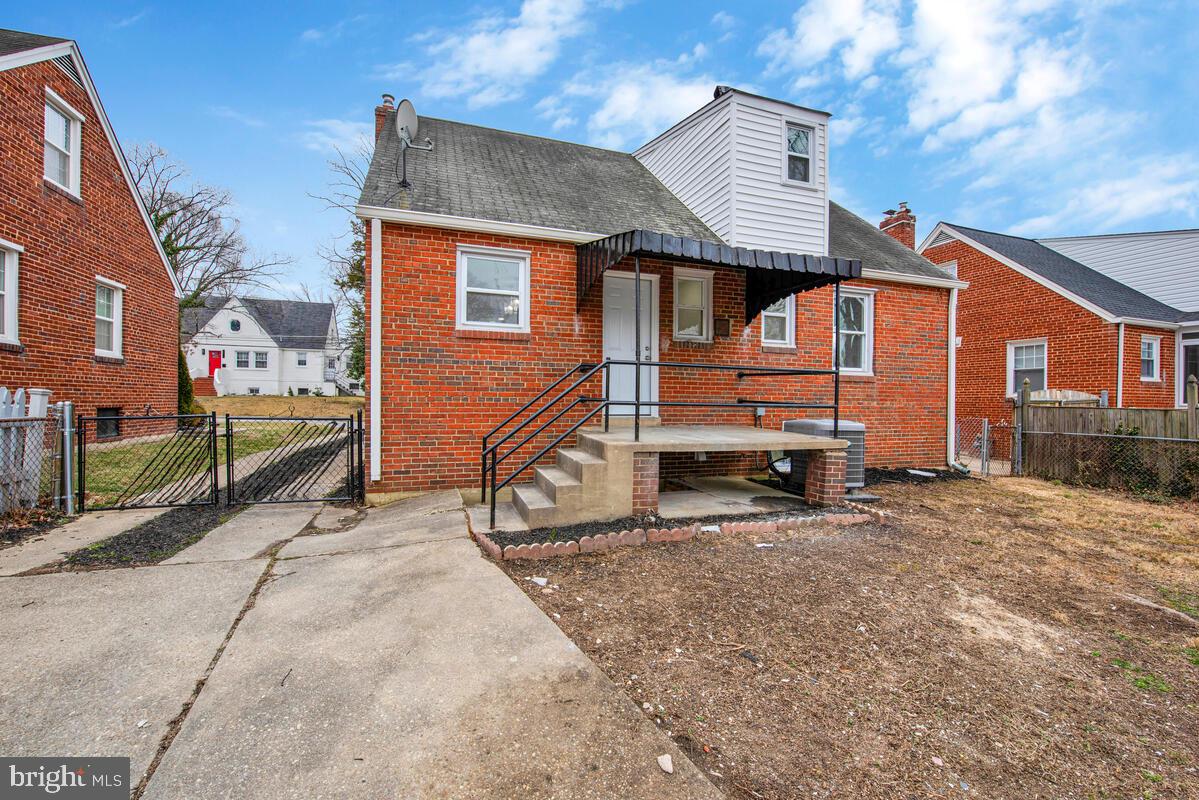 6508 Foster Street District Heights, MD 20747 - Photo 38 of 39 a view of a house with a small yard and wooden fence