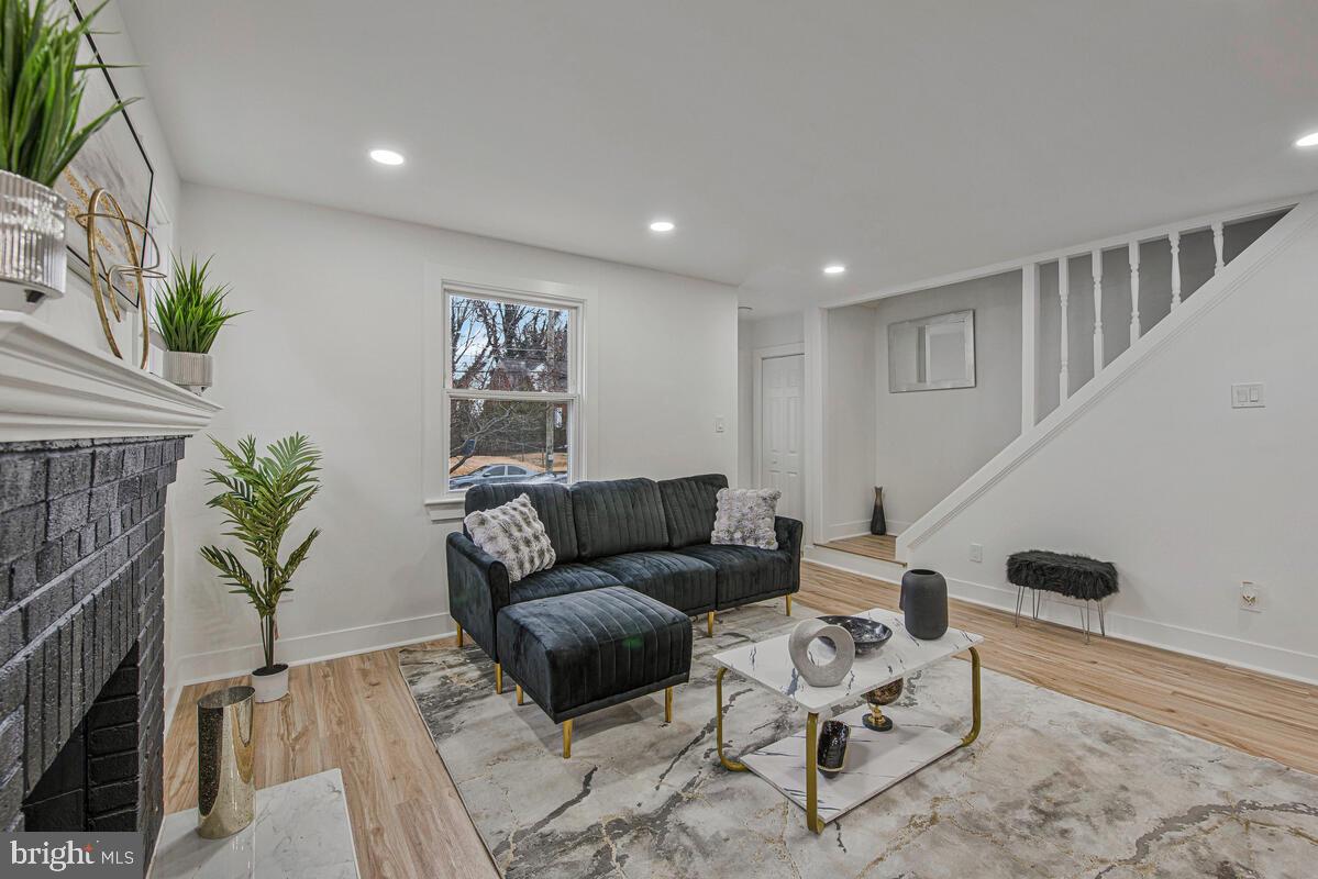 6508 Foster Street District Heights, MD 20747 - Photo 6 of 39 a living room with furniture and a potted plant