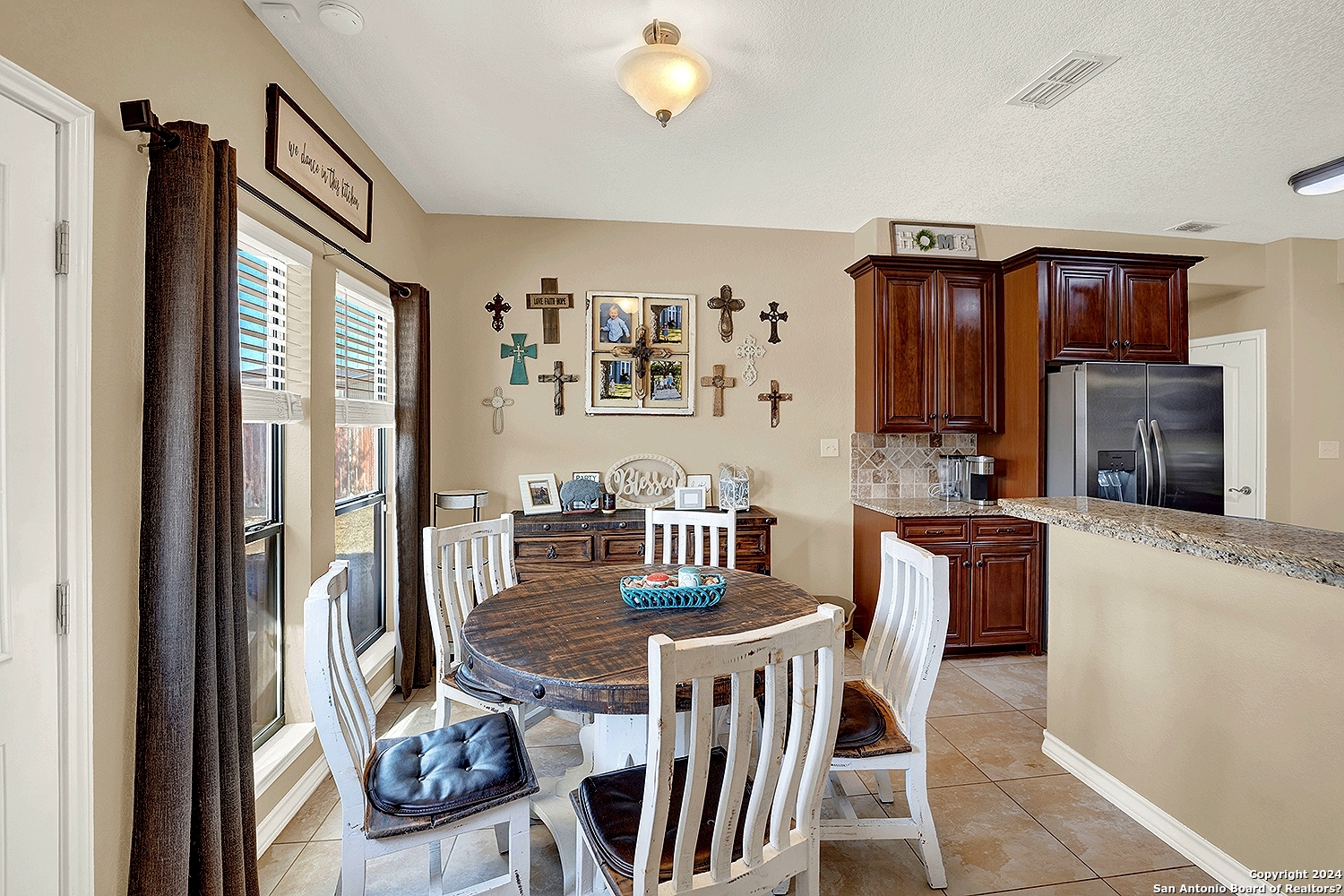 109 Park Way Poth, TX 78147 - Photo 11 of 35 a view of a dining room with furniture a kitchen and chandelier