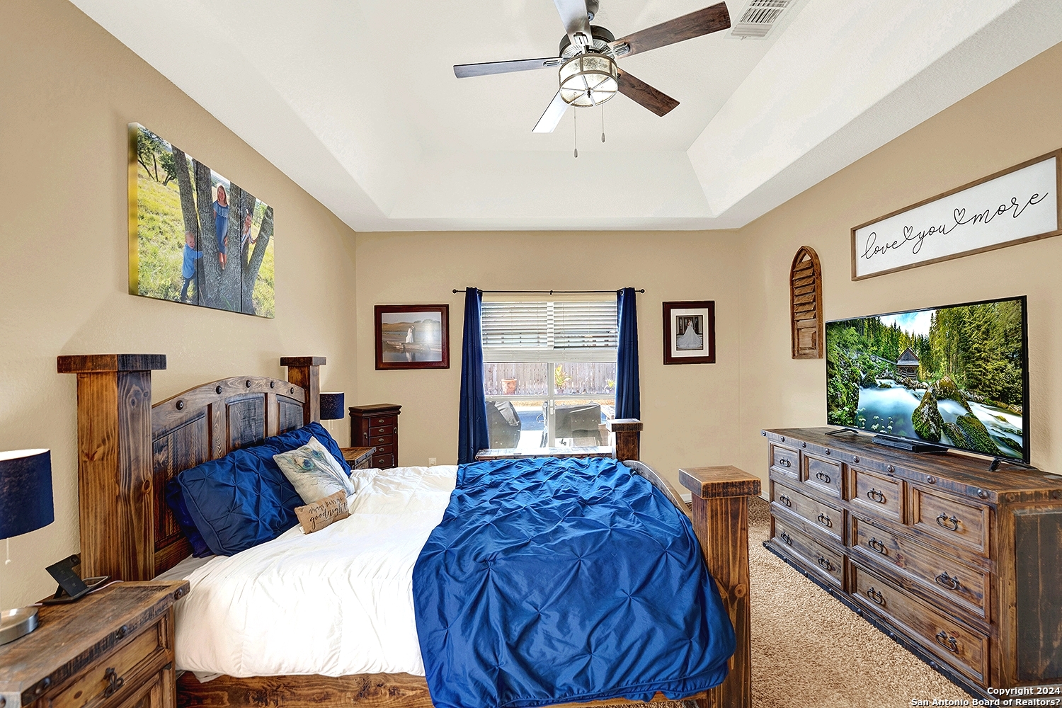 109 Park Way Poth, TX 78147 - Photo 15 of 35 a bed room with a bed window and a flat screen tv
