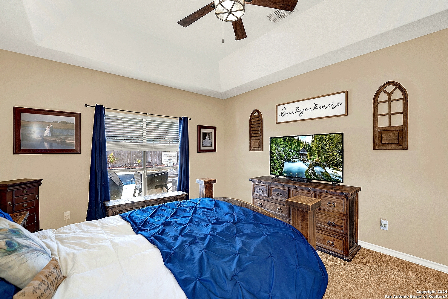 109 Park Way Poth, TX 78147 - Photo 16 of 35 a bedroom with a bed and a flat screen tv