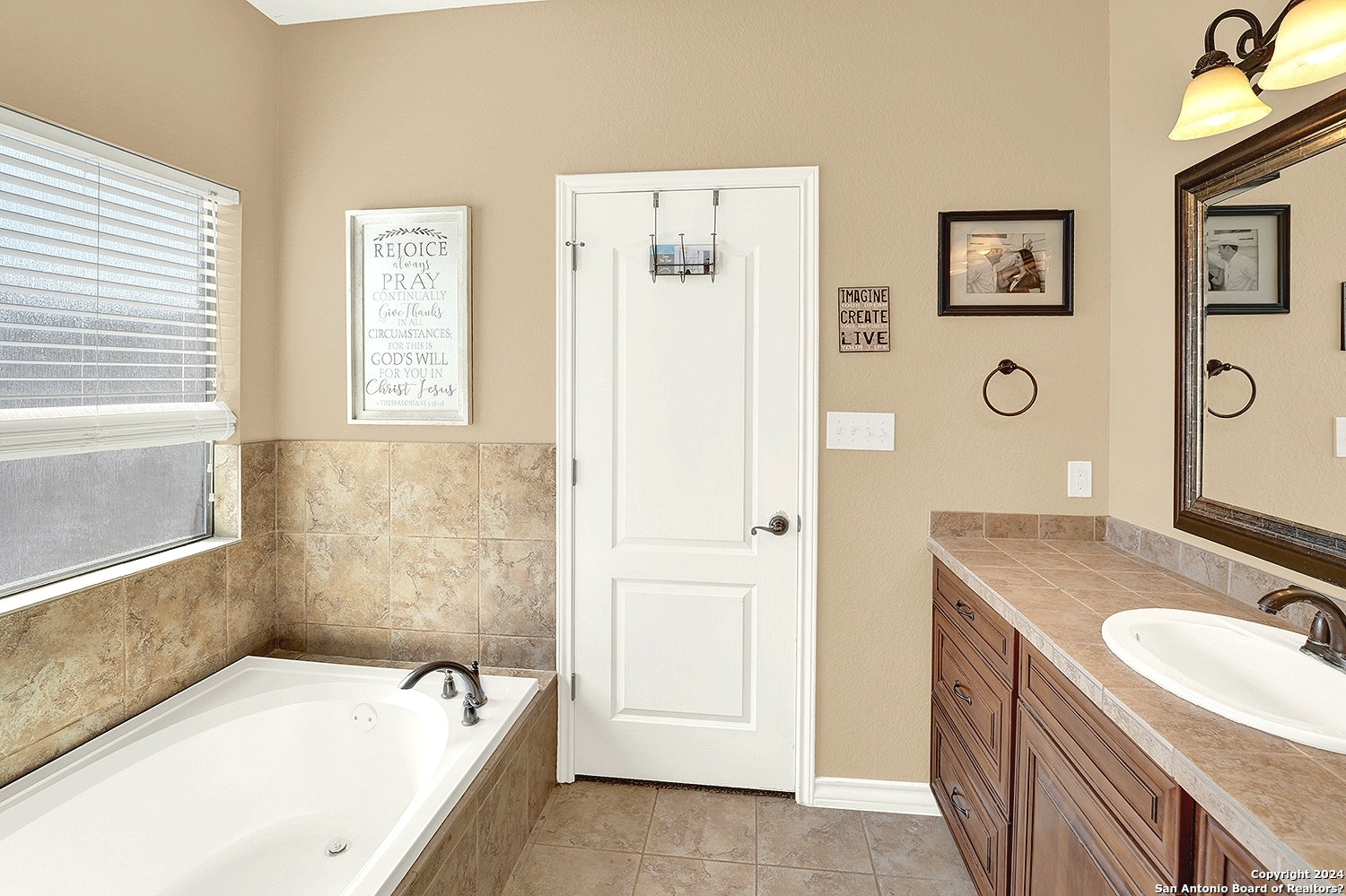 109 Park Way Poth, TX 78147 - Photo 17 of 35 a bathroom with a granite countertop tub sink and mirror