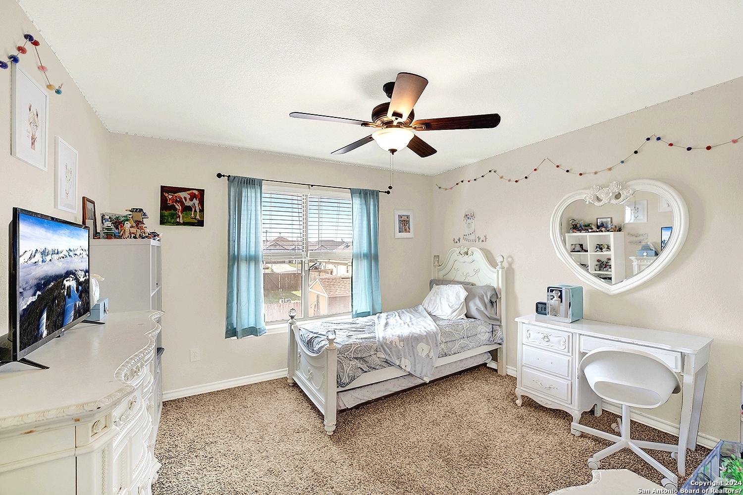 109 Park Way Poth, TX 78147 - Photo 20 of 35 a bedroom with furniture and a flat screen tv