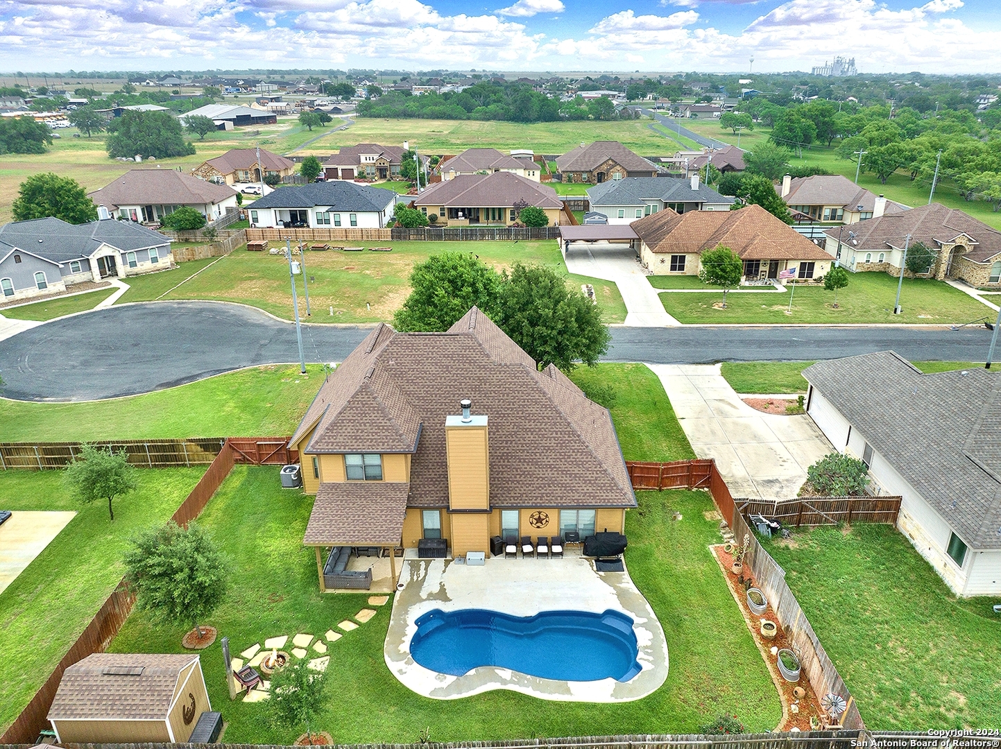 109 Park Way Poth, TX 78147 - Photo 2 of 35 an aerial view of a house with yard swimming pool and outdoor seating