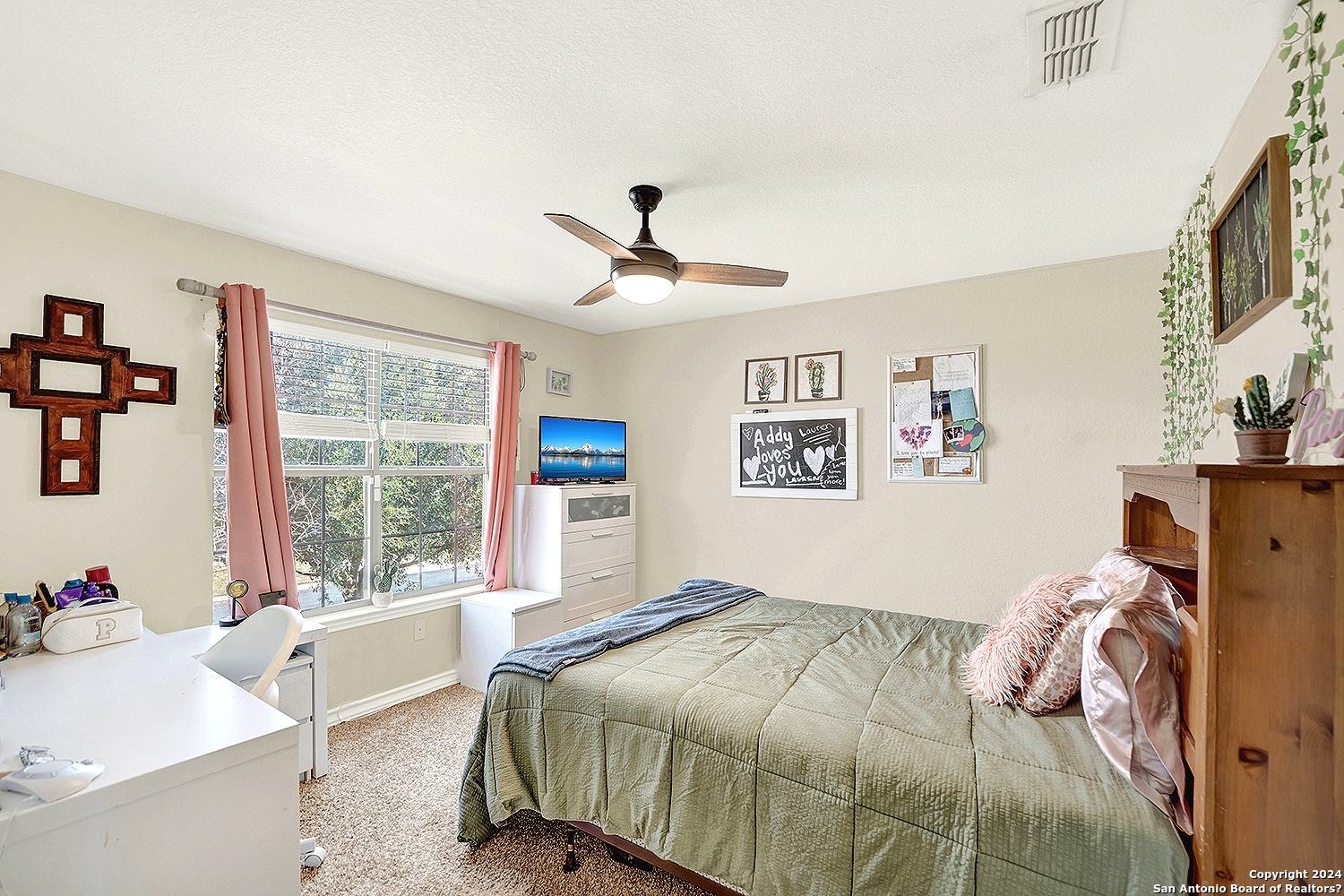 109 Park Way Poth, TX 78147 - Photo 21 of 35 a bedroom with a bed and a large window