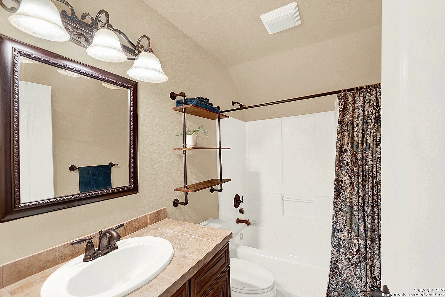 109 Park Way Poth, TX 78147 - Photo 22 of 35 a bathroom with a granite countertop sink toilet and shower