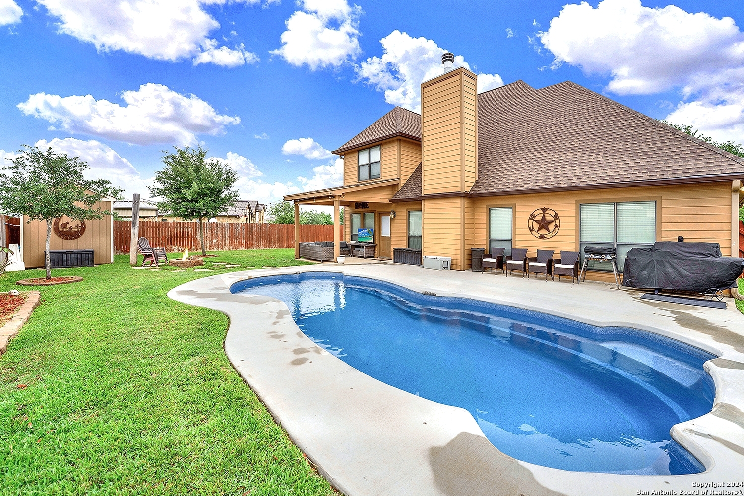 109 Park Way Poth, TX 78147 - Photo 27 of 35 a view of a house with swimming pool having outdoor seating
