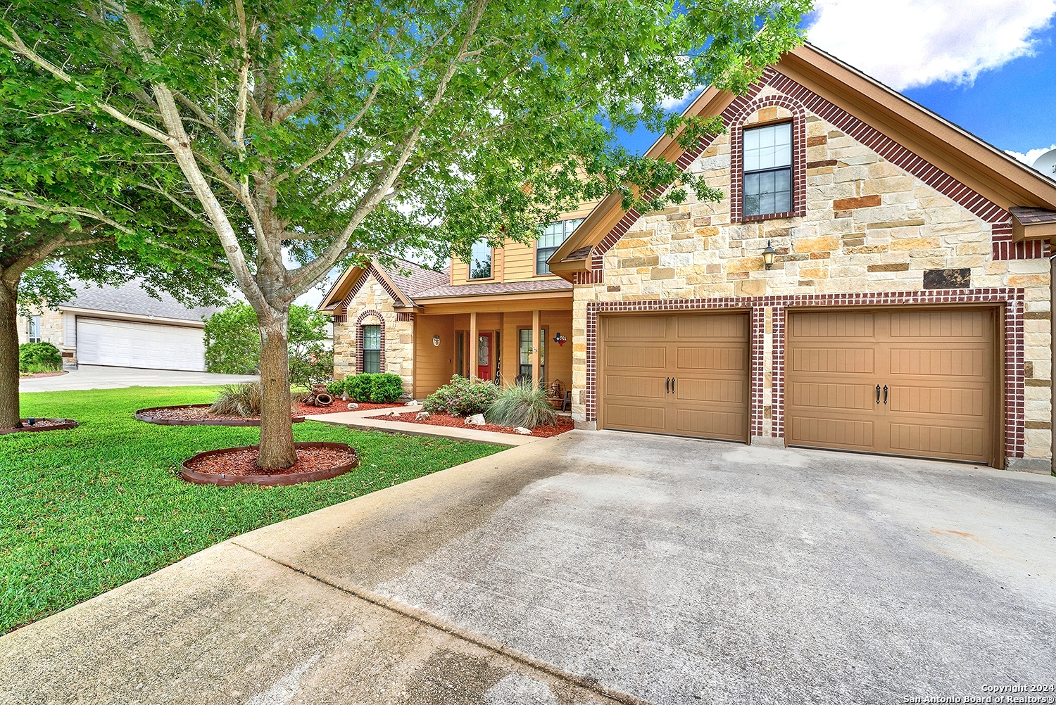 109 Park Way Poth, TX 78147 - Photo 31 of 35 a view of a house with a yard and large tree