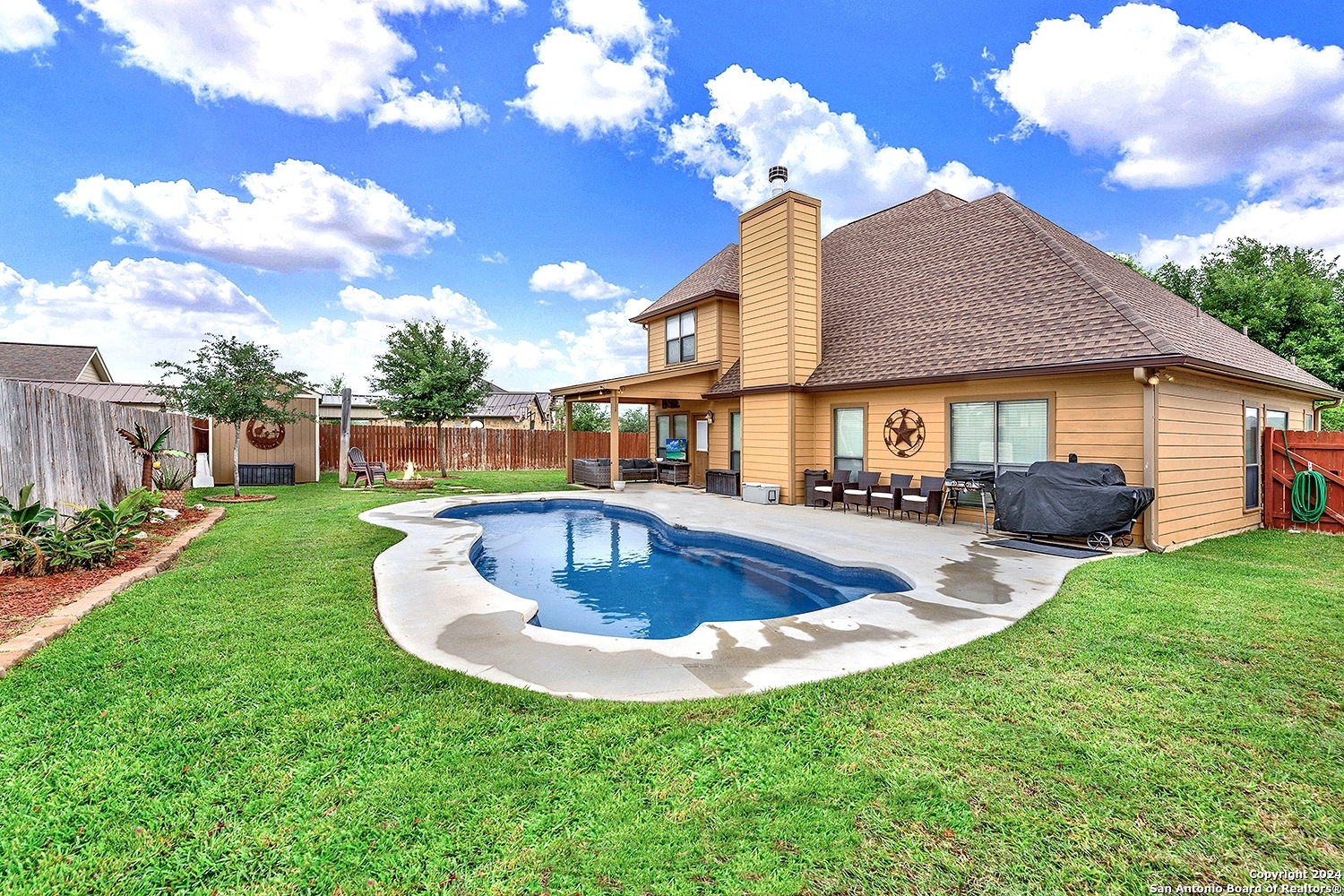 109 Park Way Poth, TX 78147 - Photo 35 of 35 a view of a house with swimming pool yard fire pit and porch
