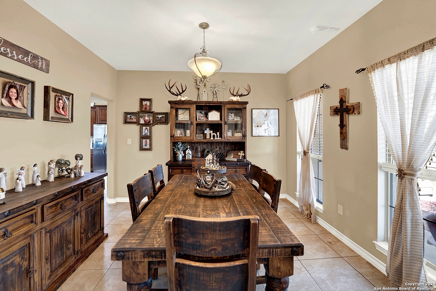 109 Park Way Poth, TX 78147 - Photo 5 of 35 a view of a dining room and livingroom with furniture wooden floor kitchen chandelier and wooden floor