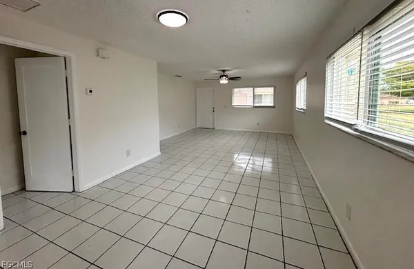 a view of an empty room and window