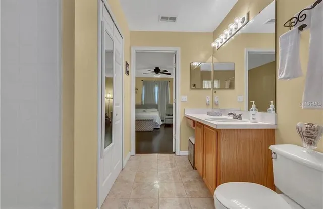 a backyard of a house with lots of green space and fountain