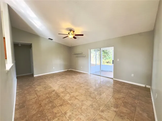 an empty room with wooden floor