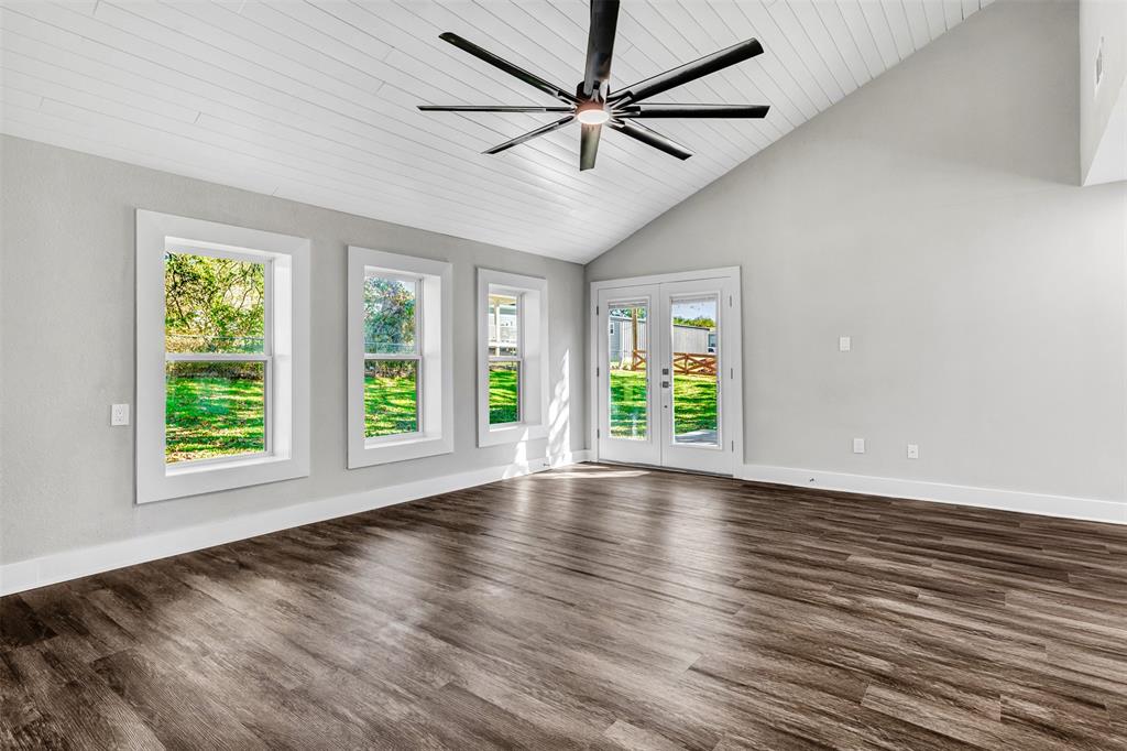 56 Crappie Road Pottsboro, TX 75076 - Photo 23 of 37 a view of an empty room with wooden floor and a window