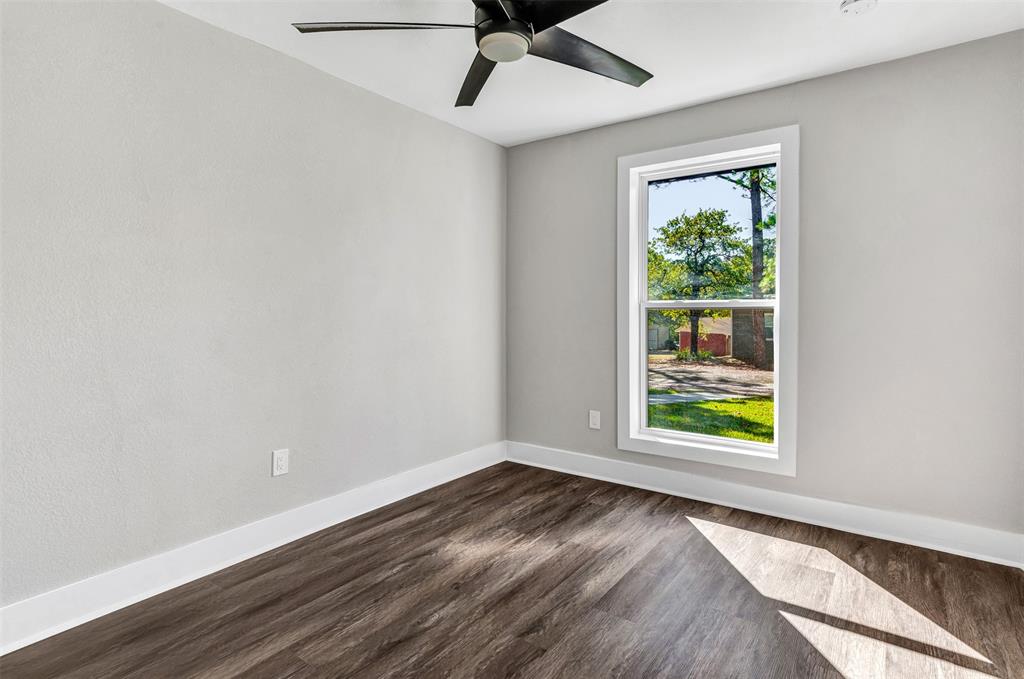 56 Crappie Road Pottsboro, TX 75076 - Photo 26 of 37 an empty room with wooden floor and windows