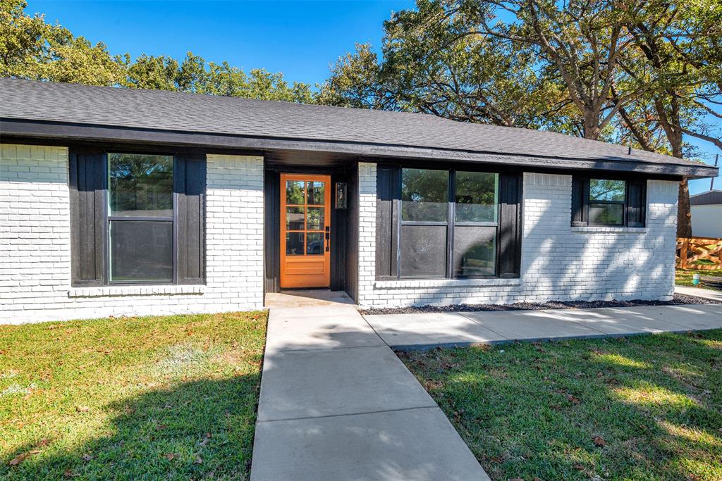 56 Crappie Road Pottsboro, TX 75076 - Photo 28 of 37 a front view of a house with garden