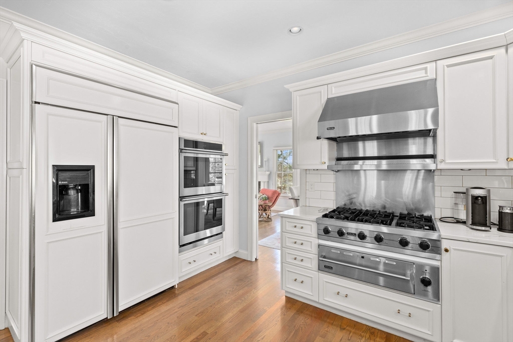 4 Baker Hill Drive Hingham, MA 02043 - Photo 11 of 40 a kitchen with stainless steel appliances a stove and a refrigerator